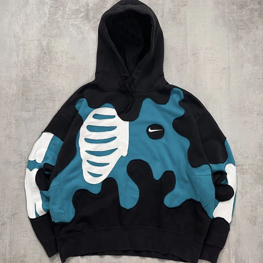 Sudadera Costillas Ola Turquesa Fearless con gráfico streetwear en hoodie unisex